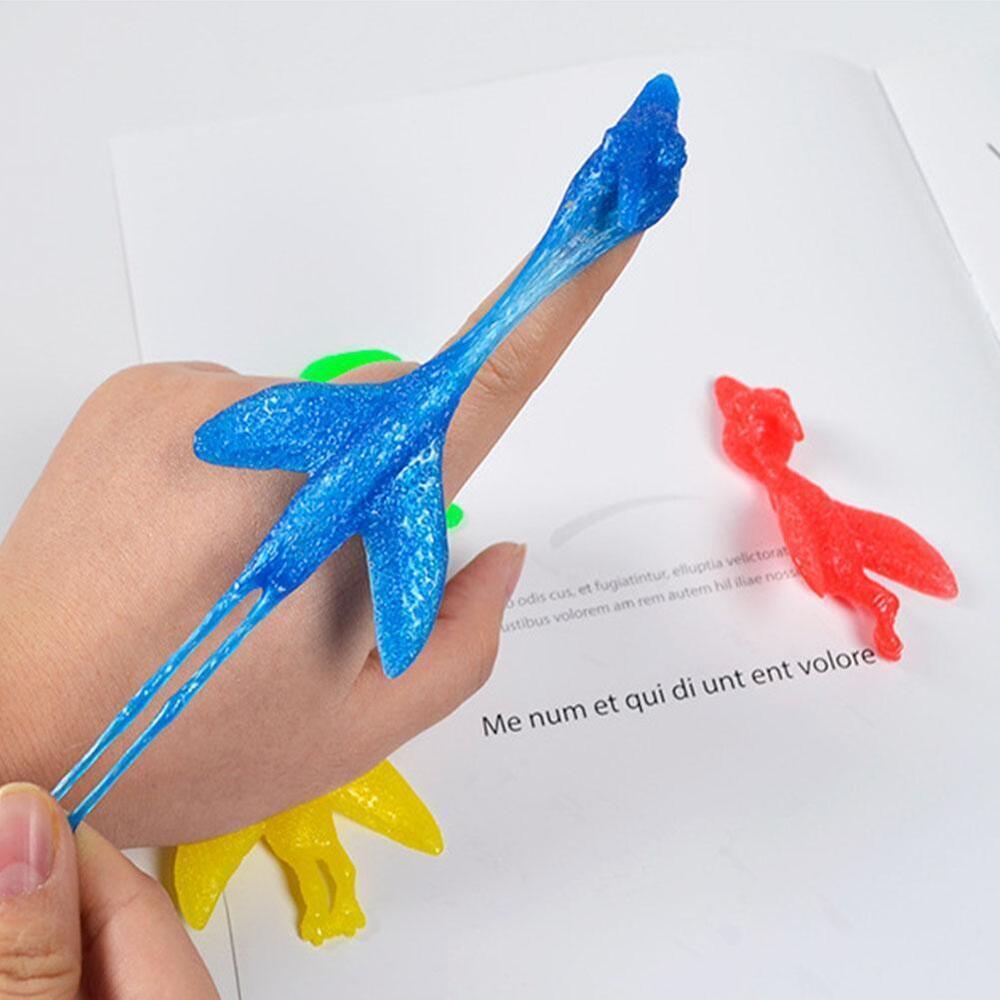 Sling shot Dinosaur Finger Toy Catapult Toy Elastic Flying Finger Dinosaur #T